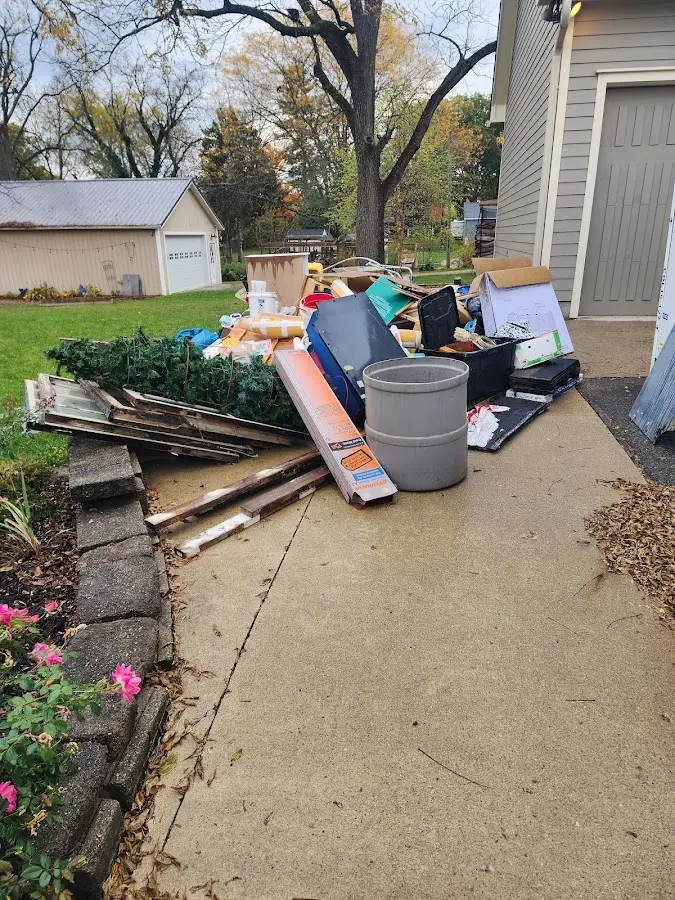 Dumpster being loaded with debris for Commercial Dumpster Rental in Independence